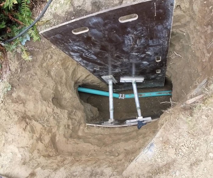 School maintenance team inspecting sewer system  
